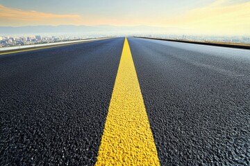 Fototapeta premium Asphalt Road Leading to the Cityscape