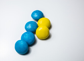 Blue and yellow round sweets