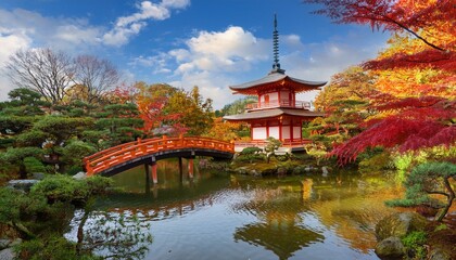 Naklejka premium autumn landscape featuring a traditional Japanese bridge and pagoda