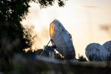 Satellite dishes at sunset