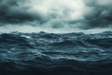 Stormy ocean waves under a dark and cloudy sky, moody atmosphere.