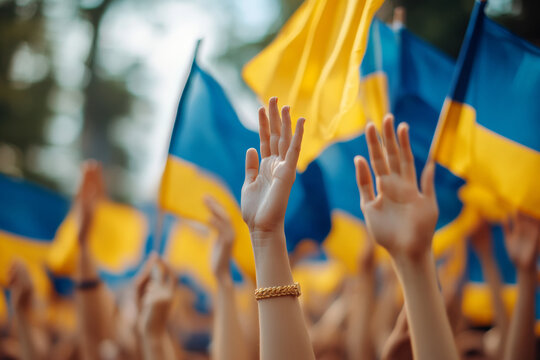 A group of people gathers around a drone displaying the Ukrainian flag, symbolizing unity and support for Ukraine amidst a backdrop of natural beauty and community spirit. - Powered by Adobe