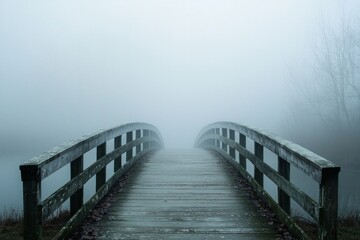 Fototapeta premium A fog-covered bridge that fades into the distance, symbolizing uncertainty or the unknown in one's mental journey 
