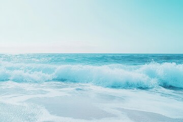 Obraz premium A Blue Ocean Wave Crashing on a Sandy Beach