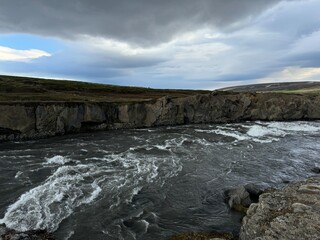 Goðafoss, Þingeyjarsveit, Iceland - rough waters at sightseeing waterfall location on midsummer day without tourists