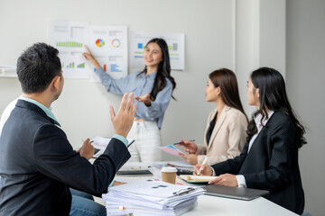 A group of people are in a meeting room