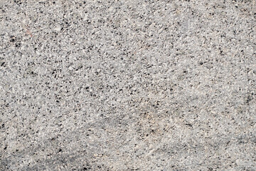 A high-resolution photograph of a textured concrete surface, perfect for backgrounds, overlays, and design elements. The image features a rough, grainy texture with subtle variations in color.