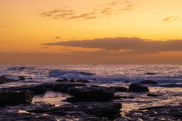 Landscape of the south coast ocean with Sunrise located  at Orange Rocks, Uvongu in Margate, South Africa