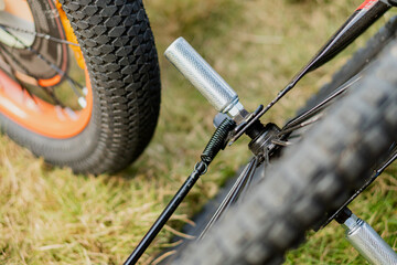 Close-Up of Bicycle Pedals and Wheels on Grass