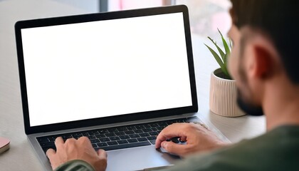 man using computer laptop in front of an blank white computer screen