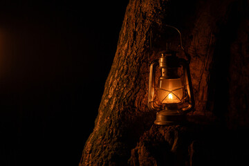 fantasy Kerosene lamp at night near tree, fairy tale atmosphere for halloween, wallpaper