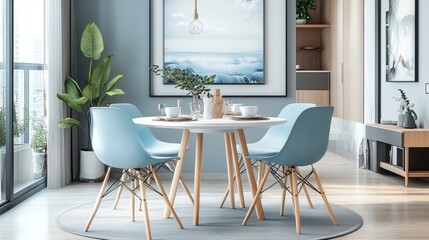 Round dining table set with four mint blue chairs, elegant white base, and light wood legs. Modern, minimalist design with square edges and circular top.