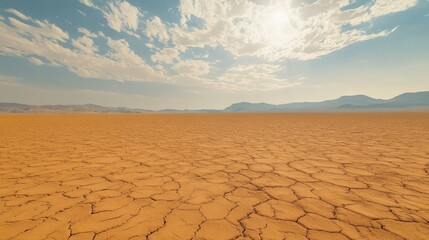 Dry and parched desert ground with subtle wind-blown patterns, open for text. No people, copy space