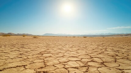 Dry and parched desert ground with subtle wind-blown patterns, open for text. No people, copy space