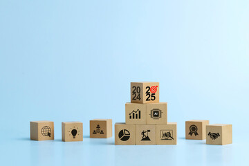 Happy New Year 2025.Business Planning Strategies 2025.wooden cubes from 2024 to 2025 target with business icons, Ideas and inspirations in the New Year. budget planning and management. achieving goals