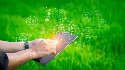 Farmers use agricultural technology in data analysis tablets and image icons. New technologies in...