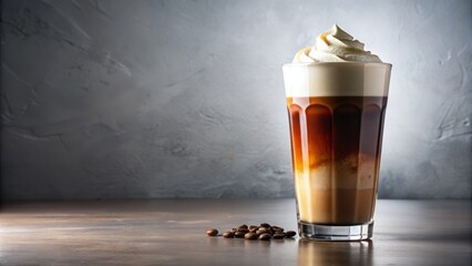 Freshly poured cold brew coffee fills a modern tumbler, topped with a velvety cream and a pinch of dark cocoa, illuminated by soft, warm light on a pristine white background.