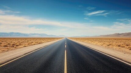 Naklejka premium A straight empty highway cutting through a desert landscape, room for text on the left side of the frame