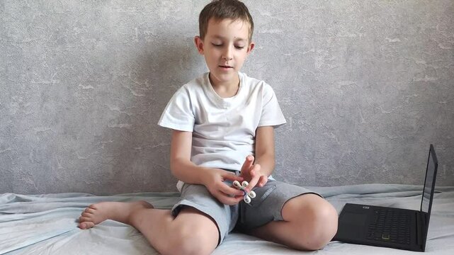 A student in home online learning is distracted and does not want to do homework. Difficulties in learning, unwillingness to study, online learning of the school curriculum, psychological problems and