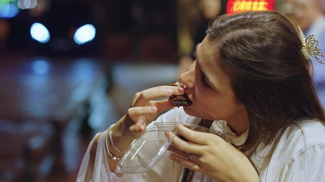 Caucasian Girl Tasting Baklava in Istanbul. Concept of Turkey Travel, Turkish Pastry, Tourism, Experience, Local Cuisine, Exploring, Tourist, Sweet, Eating