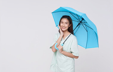 Happy asian woman patient holding umbrella isolated on white studio background. life insurance...