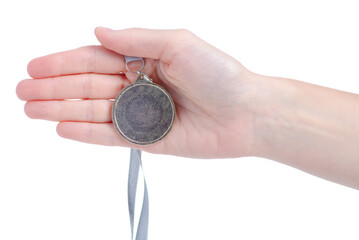 Gold Medal in hand on white background, close up