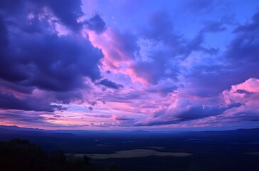 Pink And Purple Sunset Clouds Over Mountains