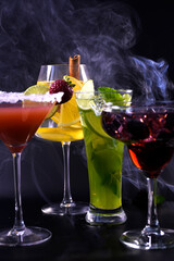 Cocktails for the evening bar. Alcoholic and non-alcoholic. Glasses for alcohol. Bright cocktails.