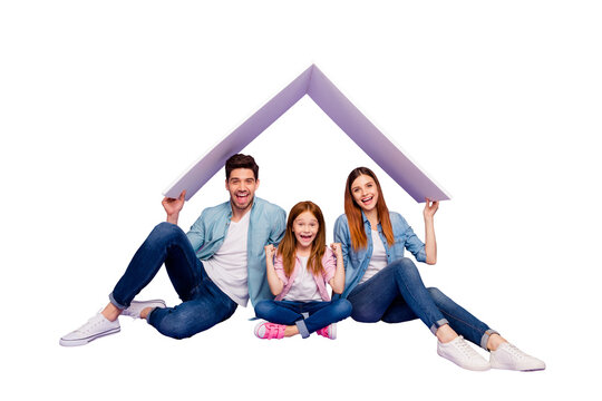 Portrait of three family members sitting floor under new roof wear casual clothes isolated purple background