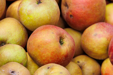 Apples and pears are for sale in wooden crates at the potato and apple market in Bächingen
