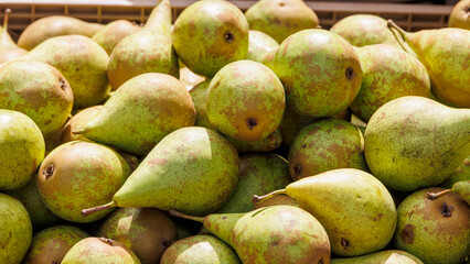 Apples and pears are for sale in wooden crates at the potato and apple market in Bächingen