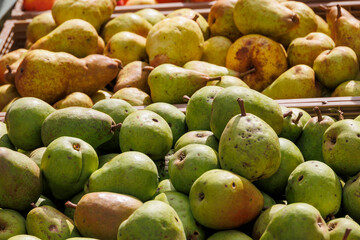 Apples and pears are for sale in wooden crates at the potato and apple market in Bächingen