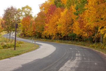 Visitors to the Pike Lake Unit, Kettle Moraine State Forest, near Hartford, Wisconsin are treated to a winding road of beautiful changing colors in early October.