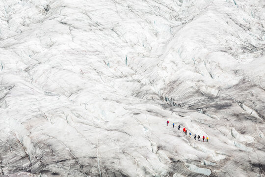 Abstract shot of people walking on a glacier