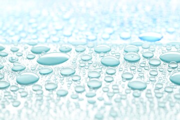 Water drops on turquoise background, above view