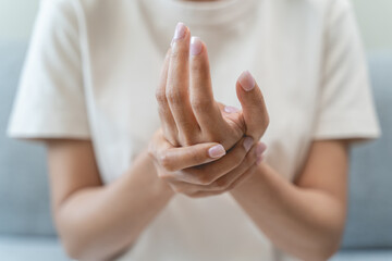 Close-up shot of human hands suffering from ligament inflammation on the palm.