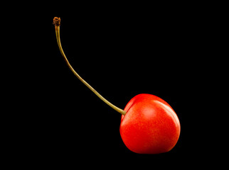 Cherry berries isolated on black background.