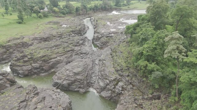 Raw footage Aerial view of river with Dam near agriculture field Located in Mayadevi Temple in Dang Gujarat.  
