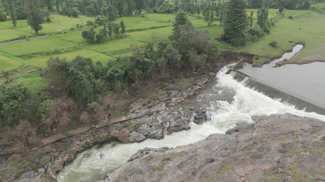 Raw footage Aerial view of river with Dam near agriculture field Located in Mayadevi Temple in Dang Gujarat.  