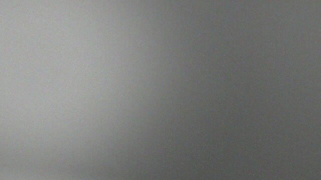 Dark background features a grainy texture with a gradient that shifts from a lighter gray on the left to a darker gray on the right. Concept of halloween, mystery, and crime titles