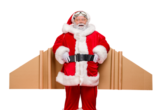 Portrait of grey-hair amazed funny elderly  santa aviator impressed by imagine adventure speed of his cardboard wings  wear cap hat belt isolated over red color background
