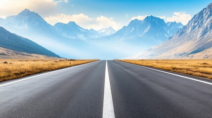 Fototapeta premium A breathtaking view of a long, straight road surrounded by majestic mountains under a clear blue sky.