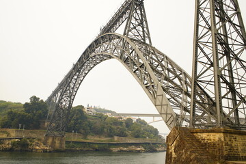 The Ponte Maria Pia was the largest arched bridge in the world when it opened in 1877. Along with the Garabit Viaduct, it is Gustave Eiffel's most famous bridge. Douro river, Porto Portugal.