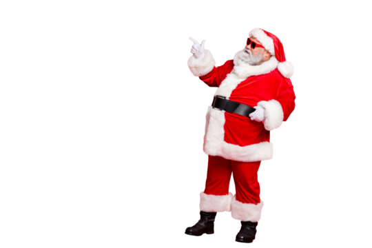 Full length profile side photo of charming santa claus in eyewear eyeglasses  showing promo wearing bright costume belt isolated over red background