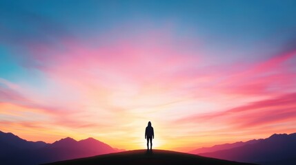 Obraz premium A silhouette of a lone figure standing against a stunning sunset, representing peace and reflection.