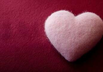 Obraz premium Pink Felt Heart on Burgundy Background