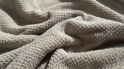 Interior fabric. Beige terry towel cotton fabric. Towels. Cotton fabric texture. Textile light...