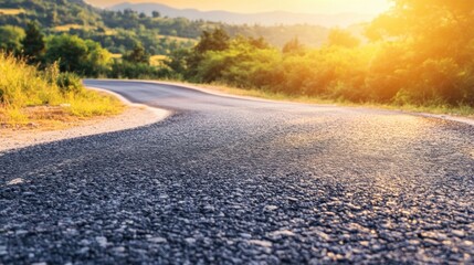 Winding country road at sunset in scenic landscape