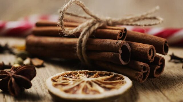 Close up view of romatic spices lying on round wooden plate