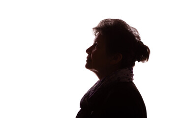 Dark silhouette of an elderly woman, pensioner, curly hair - isolate